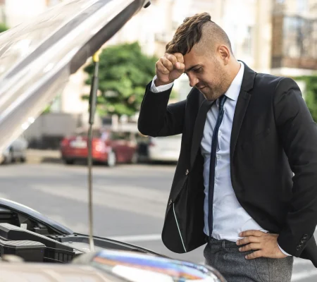 side-view-business-man-trying-fix-his-car