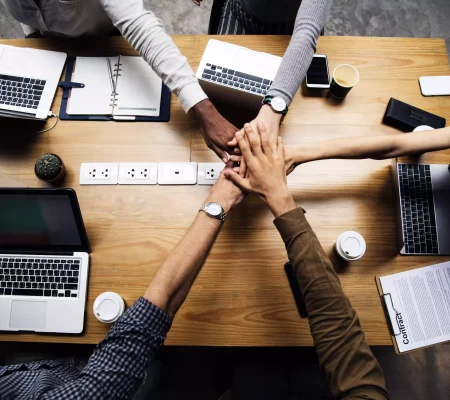 team-business-people-stacking-hands-min