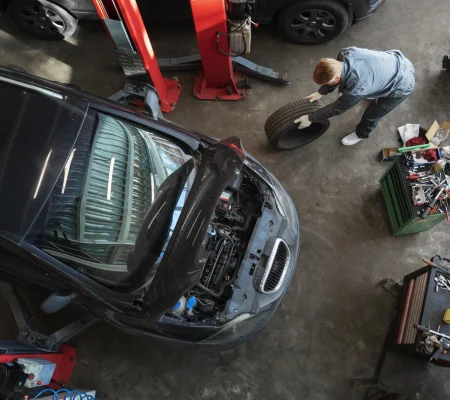 top-view-man-repairing-car